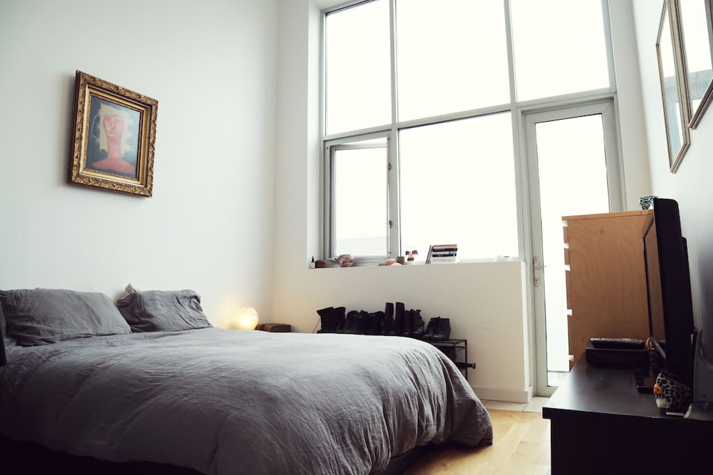 The bedroom - big and bright. The mattress is a queen memory foam.