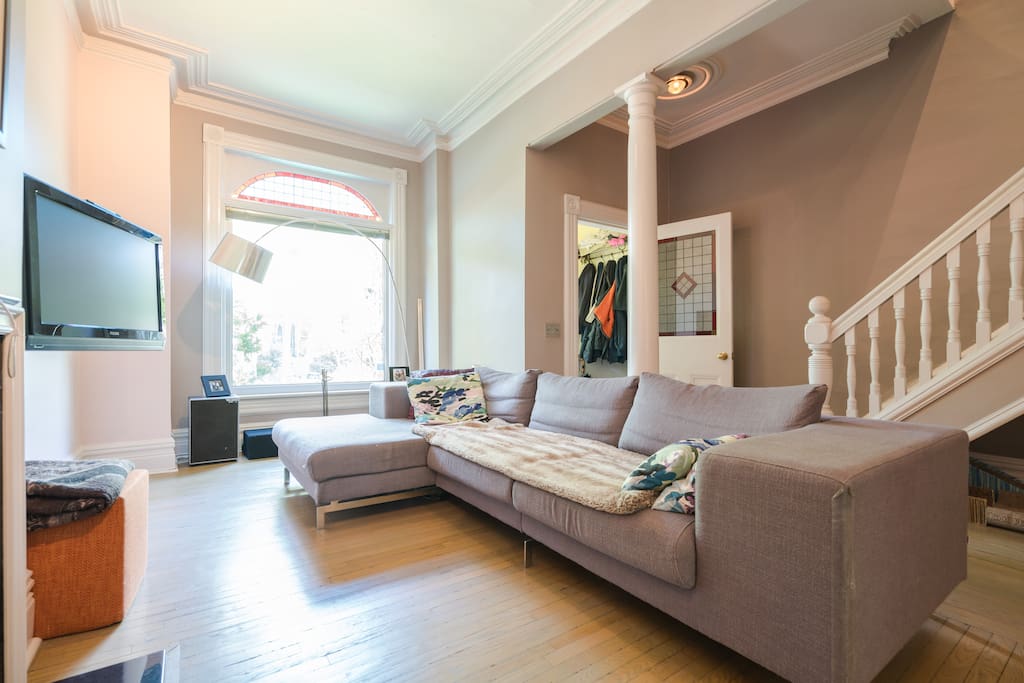 Large comfy Scandinavian design couch for watching TV (Netflix), read or enjoy the fireplace.