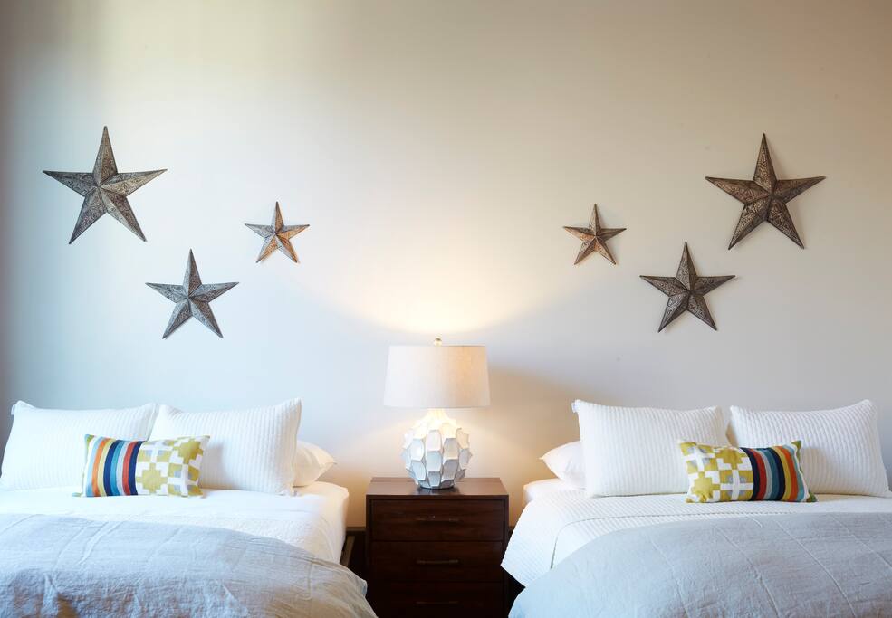 Suite 3: This north facing, double queen suite comes w/ stunning views of downtown MKE, exposed Cream City brick and offerings from some of Milwaukee’s finest artists. Also, featuring Apple TV, high speed internet and local cable, this suite can adjoin suite 5 to make any family feel at home.