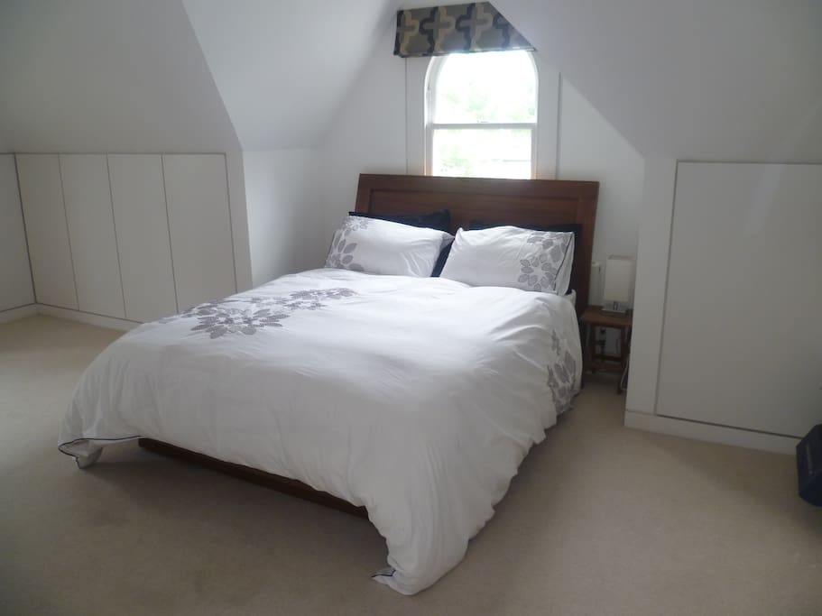 Spacious double bedroom and storage.