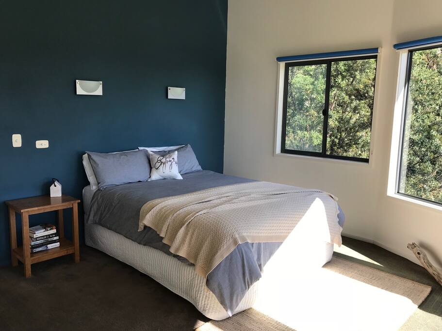 Mid-level bedroom with uninterrupted views of Kennett River and forest