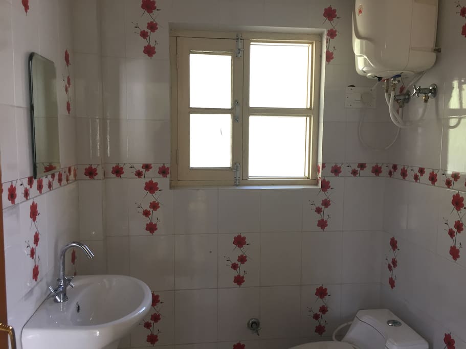 Bathroom with window and sink.