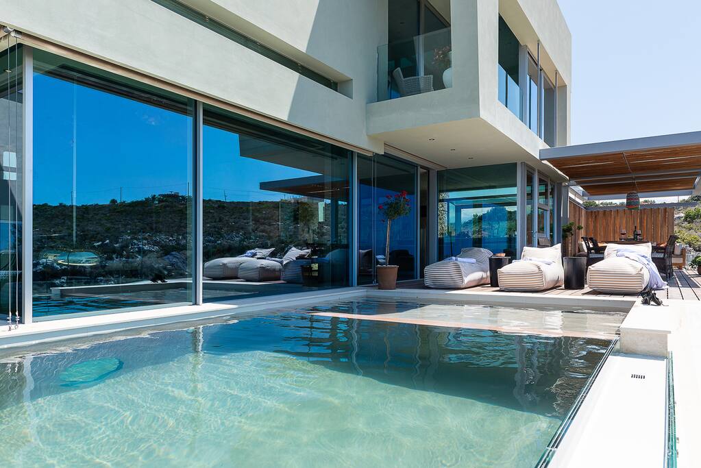 Swimming pool area with luxurious and comfort cushions