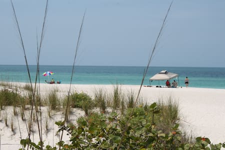 Beautiful Condo , 30 steps to Beach,  Heated Pool