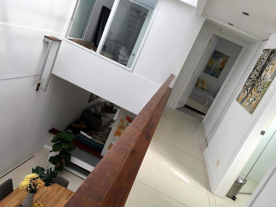 Bedroom at end of corridor, bathroom on right with spa bath! Looking over balcony to dining room.