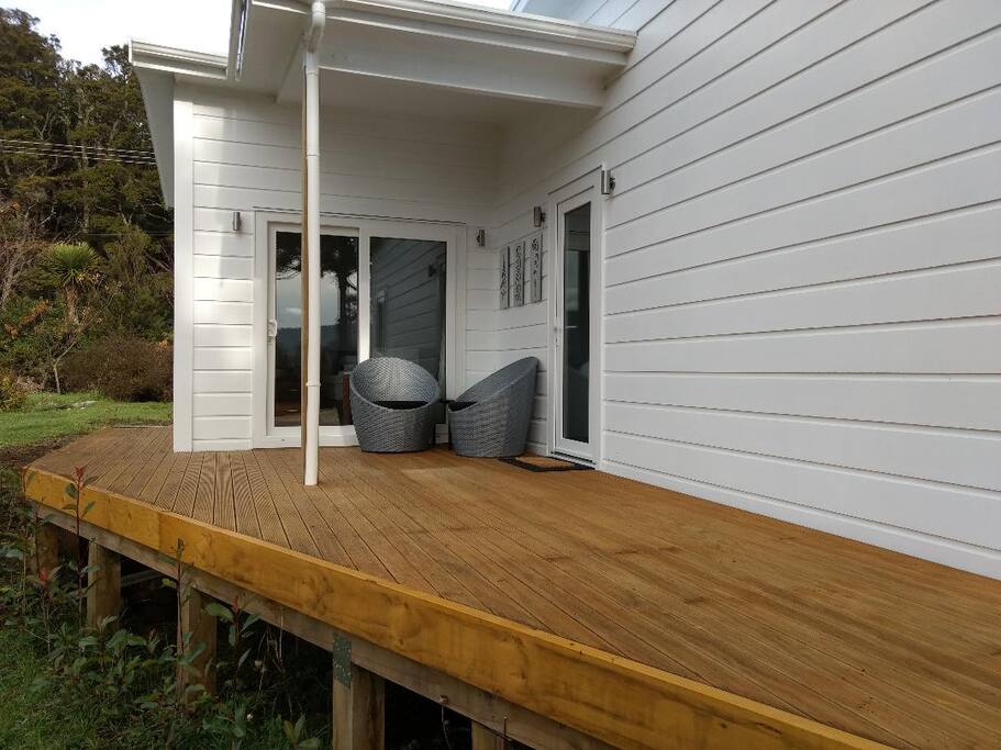 Entryway, deck and covered sitting area