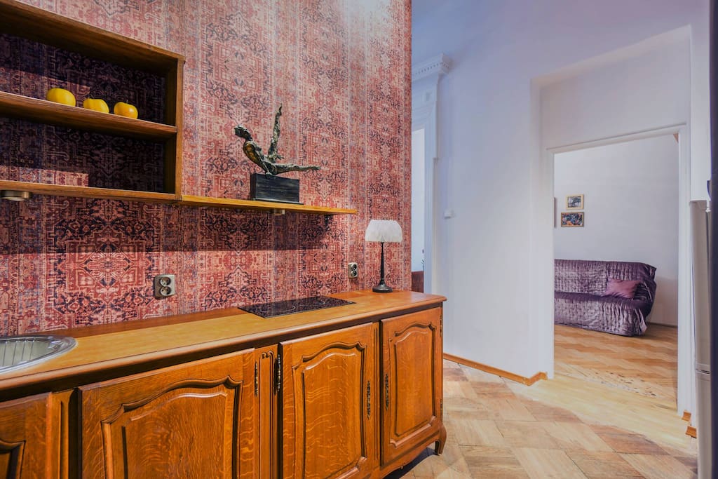 Kitchenette and view of a smaller room