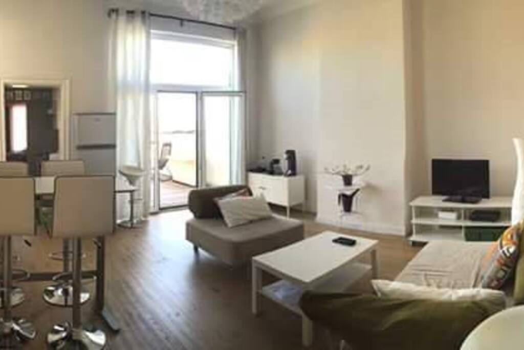 The living room is the center of the apartment. With the high table and the cosy couches the living room is dining room and relax zone as well. TV with HDMI cable for laptops, small sound system with Ipod docking station and a wireless keyboard will help you to stay entertained on rainy days.