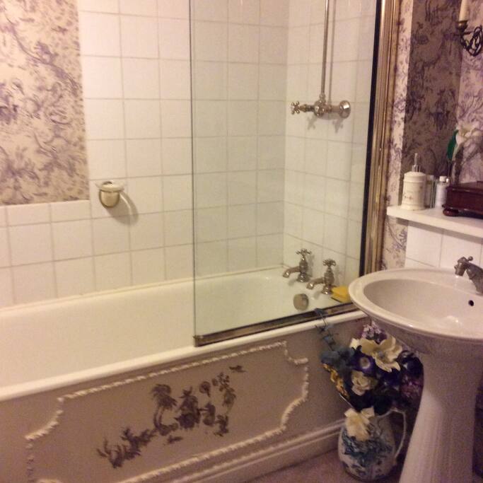 Ensuite bathroom with bath and shower.