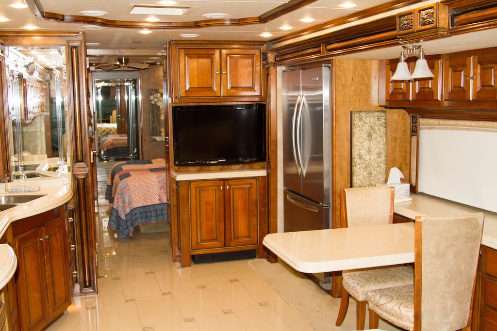 Kitchen/dining area with full fridge