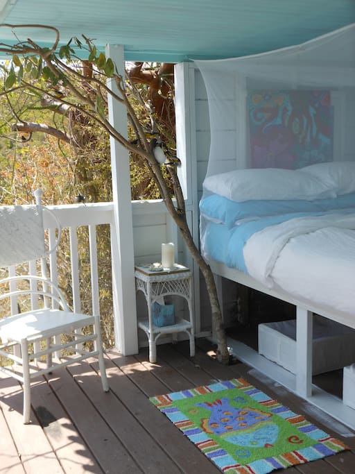 The Life's A Beach Suite includes a super-comfy, open-air queen bed with a view of the Caribbean Sea, banana quits and a tree at your bedside, fan, reading light, great breezes, awesome sunrises you can see without lifting your head from the pillow!