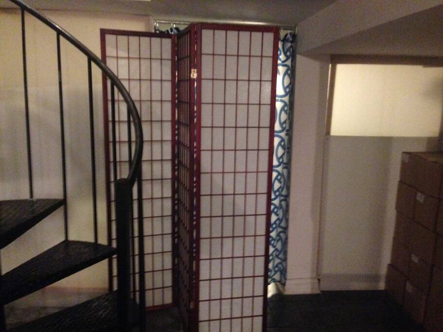 Entrance Bedroom at bottom of basement stairs