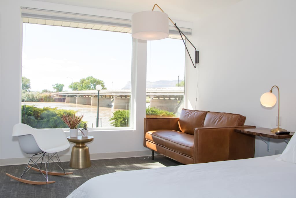 The Crystal Geyser Guestroom with views of the Green River and Book Cliff Mountain Range behind