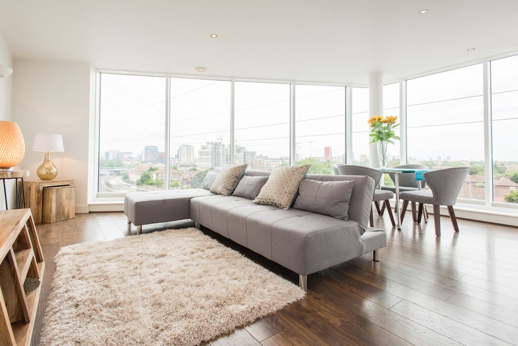 Open plan living room, dining area with balcony