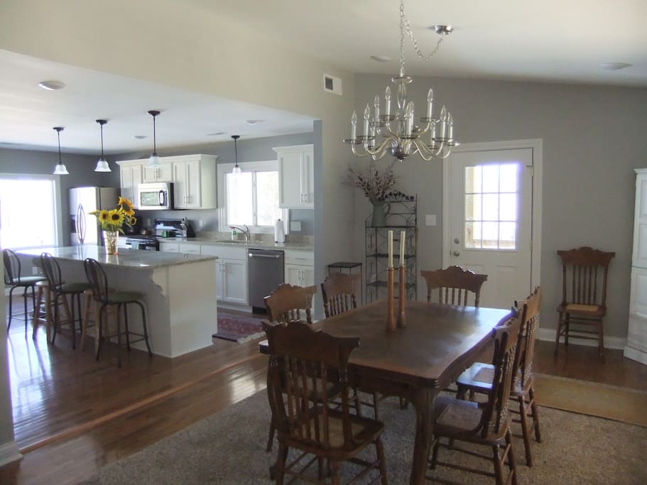 Open concept, dinning room with large windows and lots of natural light through out the house
