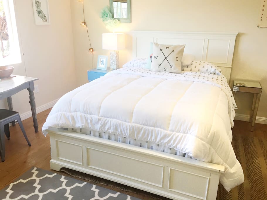 Queen bed from Tufts and Needle in the bedroom.