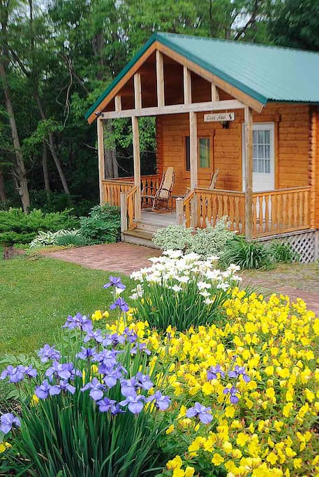 Enjoy views of the flower gardens from your front porch.