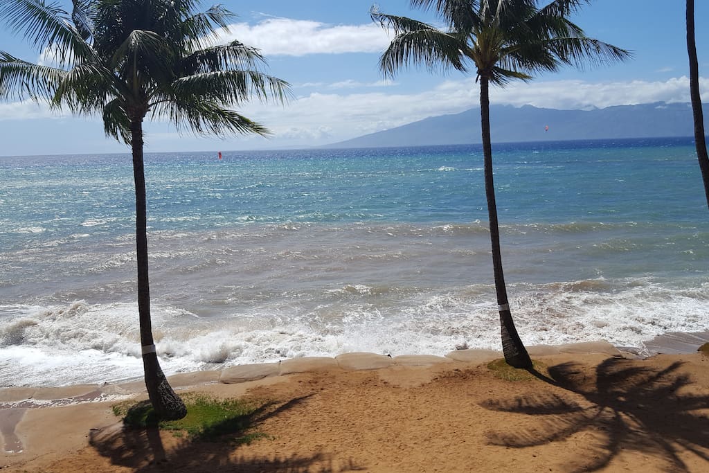 Our winter beach even with some sand bags due to the surge.... View from our lanai