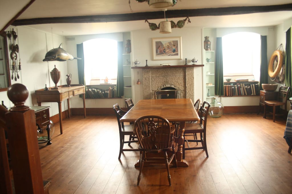 Your dining room with working fire for cold winter nights.
Yes that is a plaster cast porpoise my grandfather made hanging on the left.