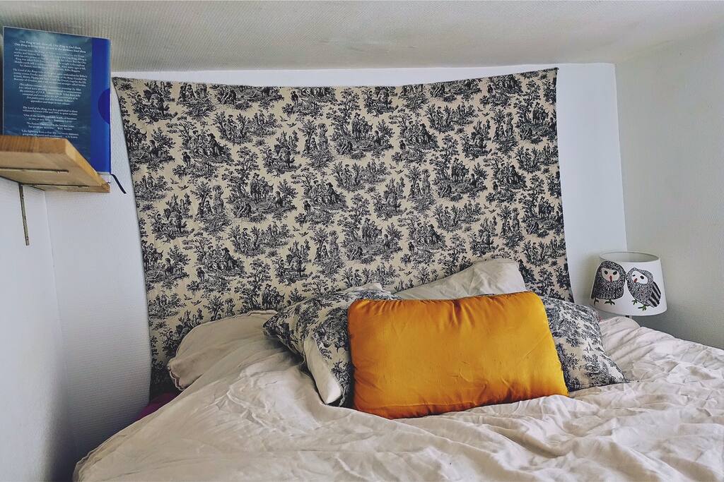 Mezzanine bed is located on a small "half-floor" easily accessible by ladder.