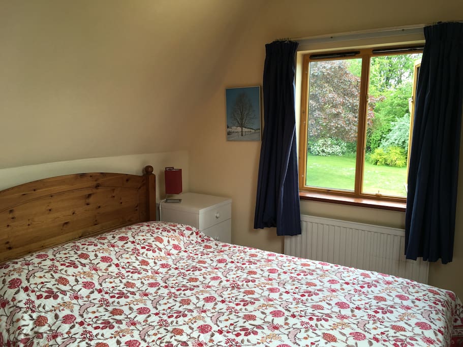 Double bedroom with lovely views over a private garden and church