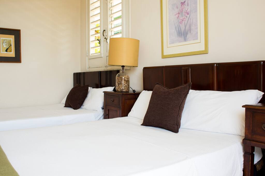 Bedroom is furnished with Queen size beds. Room is clean and very comfortable with fridge, aircon, fan and plenty of space.