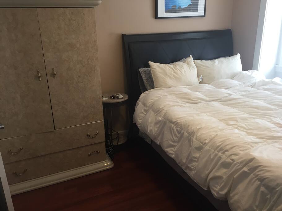 Queen bed with down duvet/sheets. Armoire.