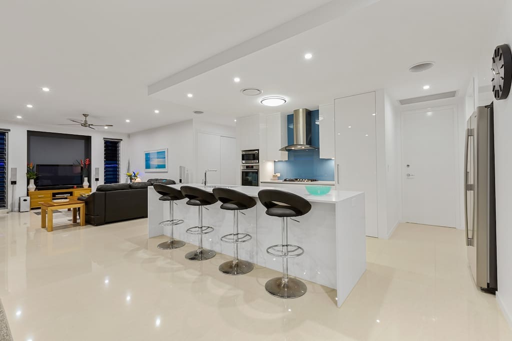 open plan kitchen dining lounge room