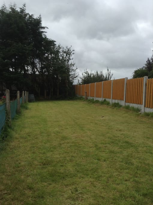 Large garden with chairs and gas BBQ