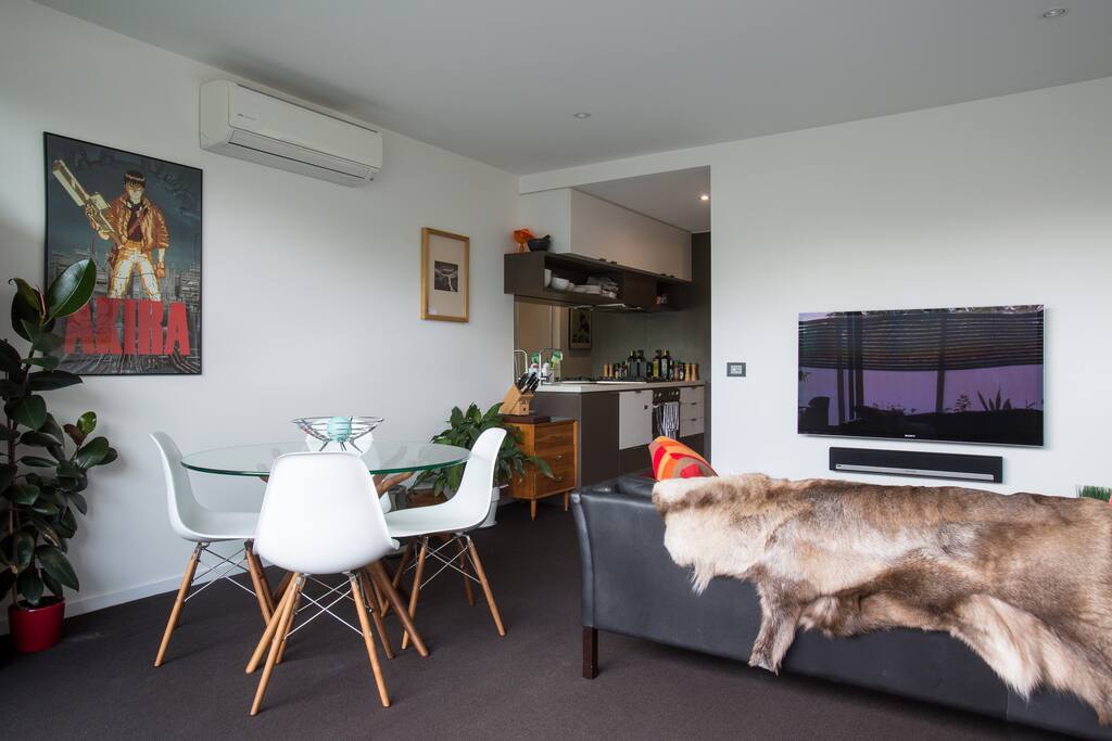 Living area with 50 inch TV, Sono's play bar, leather couch