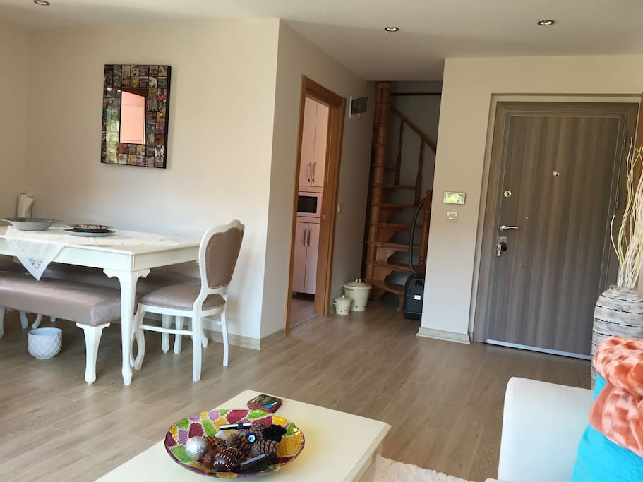 Entrance, living room and kitchen. Stairs to upper floor.