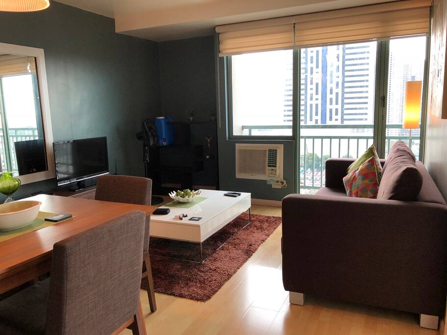 Main living room corner unit with floor to ceiling windows.