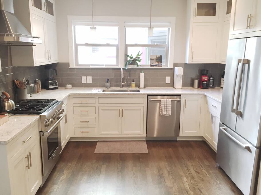 Large kitchen stocked with cooking essentials.