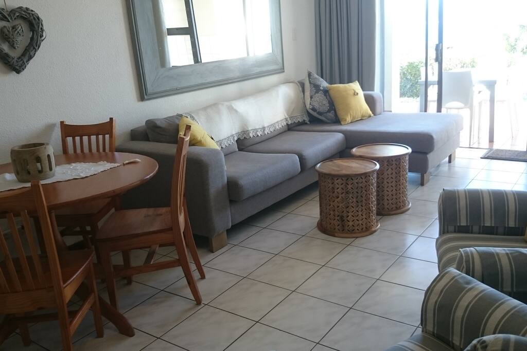 The comfortable lounge offers plenty of seating opening out to the patio and that spectacular view