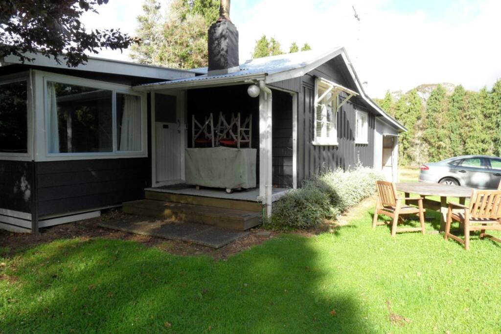A fully fenced outdoor area with internal access garage and gas bbq at the cottage.