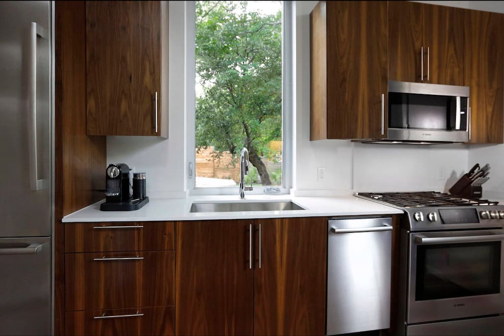Bosch appliances, walnut cabinets and convenient coffee by Nesspresso. I usually have some local brews in the fridge. The kitchen is stocked with basic cooking utensils to make meals.