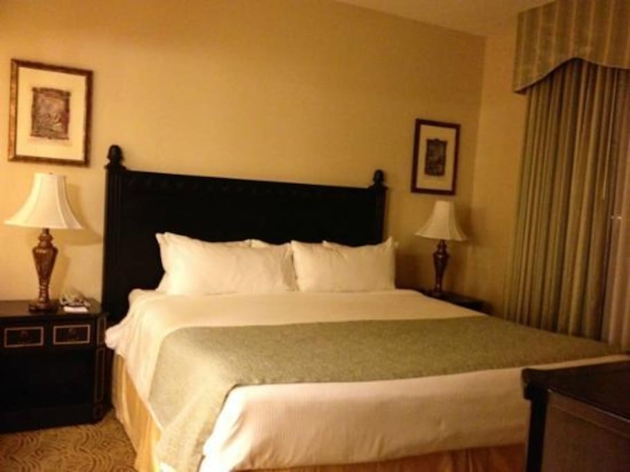 Bedroom with King Size Bed. Please note that layout and decor varies.
