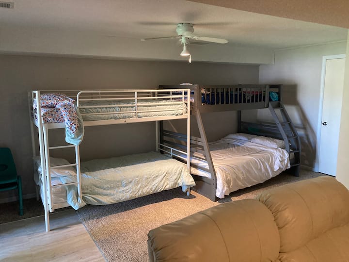 The kids room is in the lower level which now has a full sofa and love seat and walks directly out to the patio and beach.