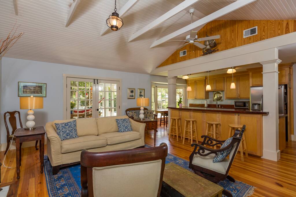 Kitchen with bar open to living room