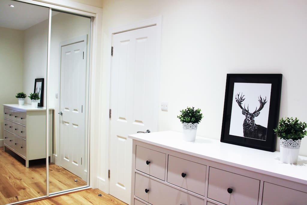 Floor to ceiling mirrored wardrobe
