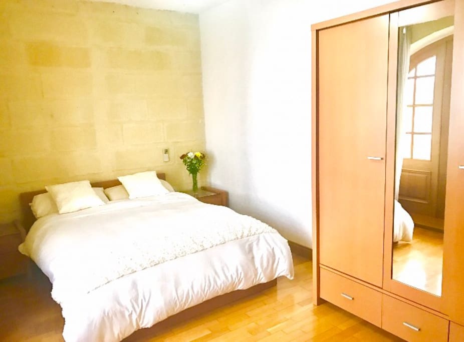 Bedroom with triple wardrobe