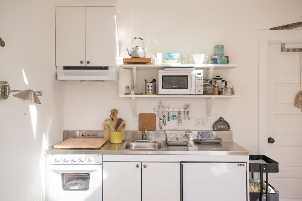 Stove, microwave, refrigerator & freezer.