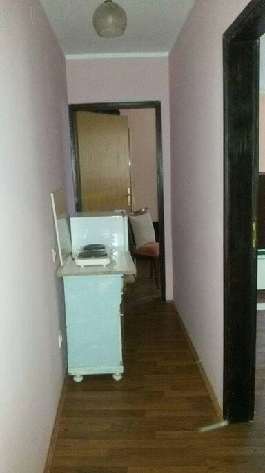 A hall way kitchenette