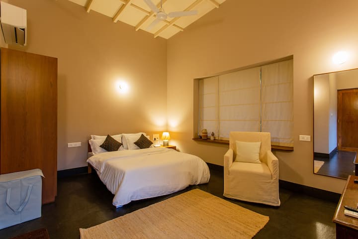 The bedroom on the top floor is a beautiful space to be in.