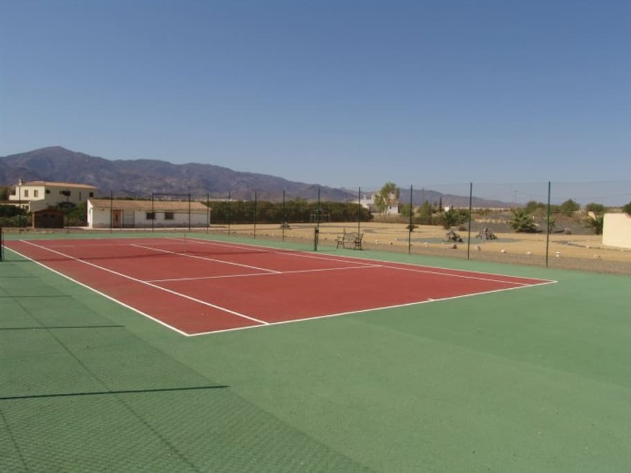 Private all weather tennis court showing mountain views in background