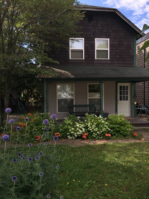 The cottage is nestled behind Lake Flower Landing, a 2-story building, which adds a sense of privacy.