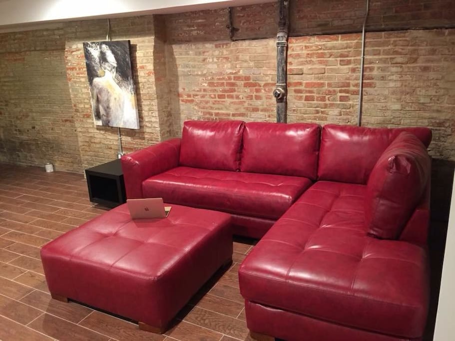 Beautiful exposed brick living room in charming apartment