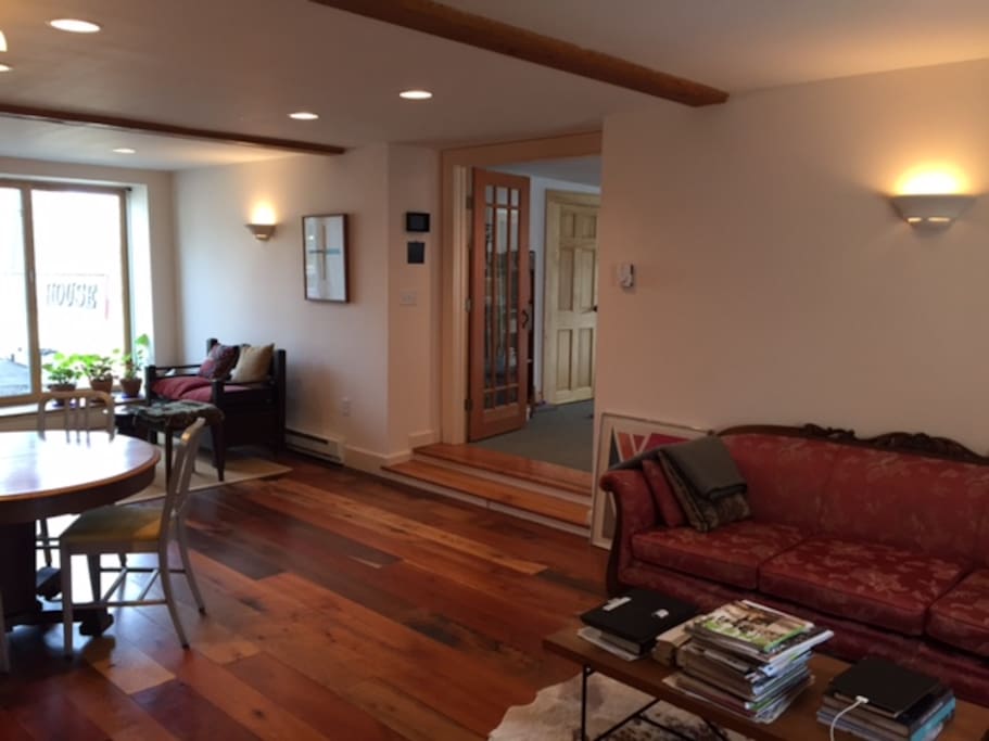 Living & kitchen with doors to patio