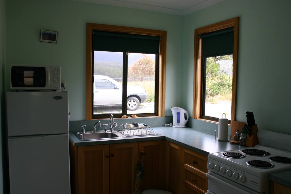 Full kitchen with microwave, fridge freezer and oven.