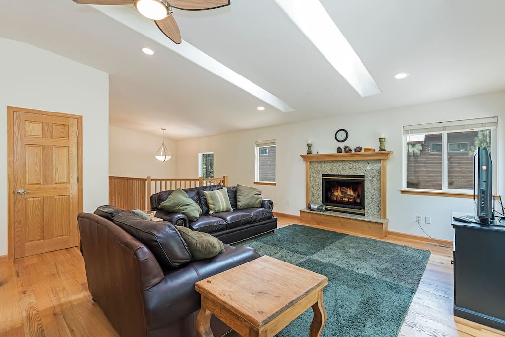 Living room with a gas fireplace and comfortable couch seating